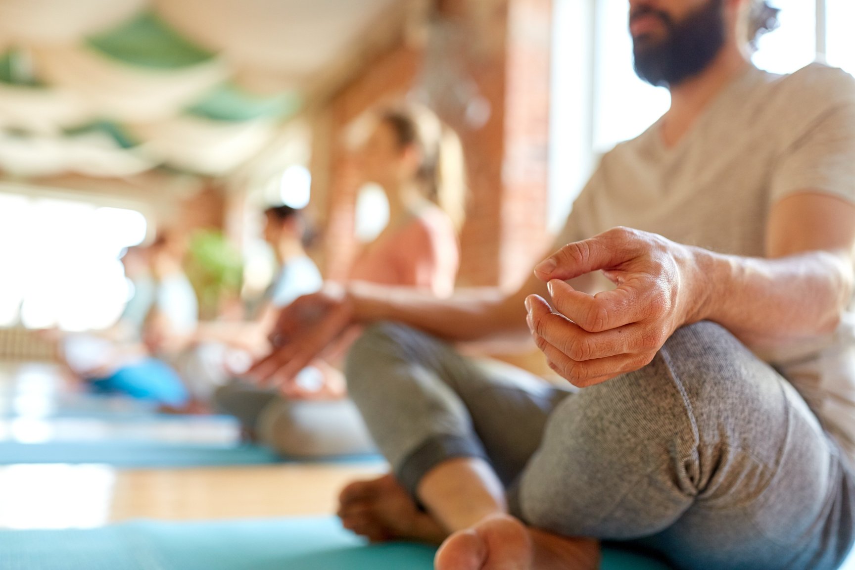 Group of People Making Yoga Exercises at Studio