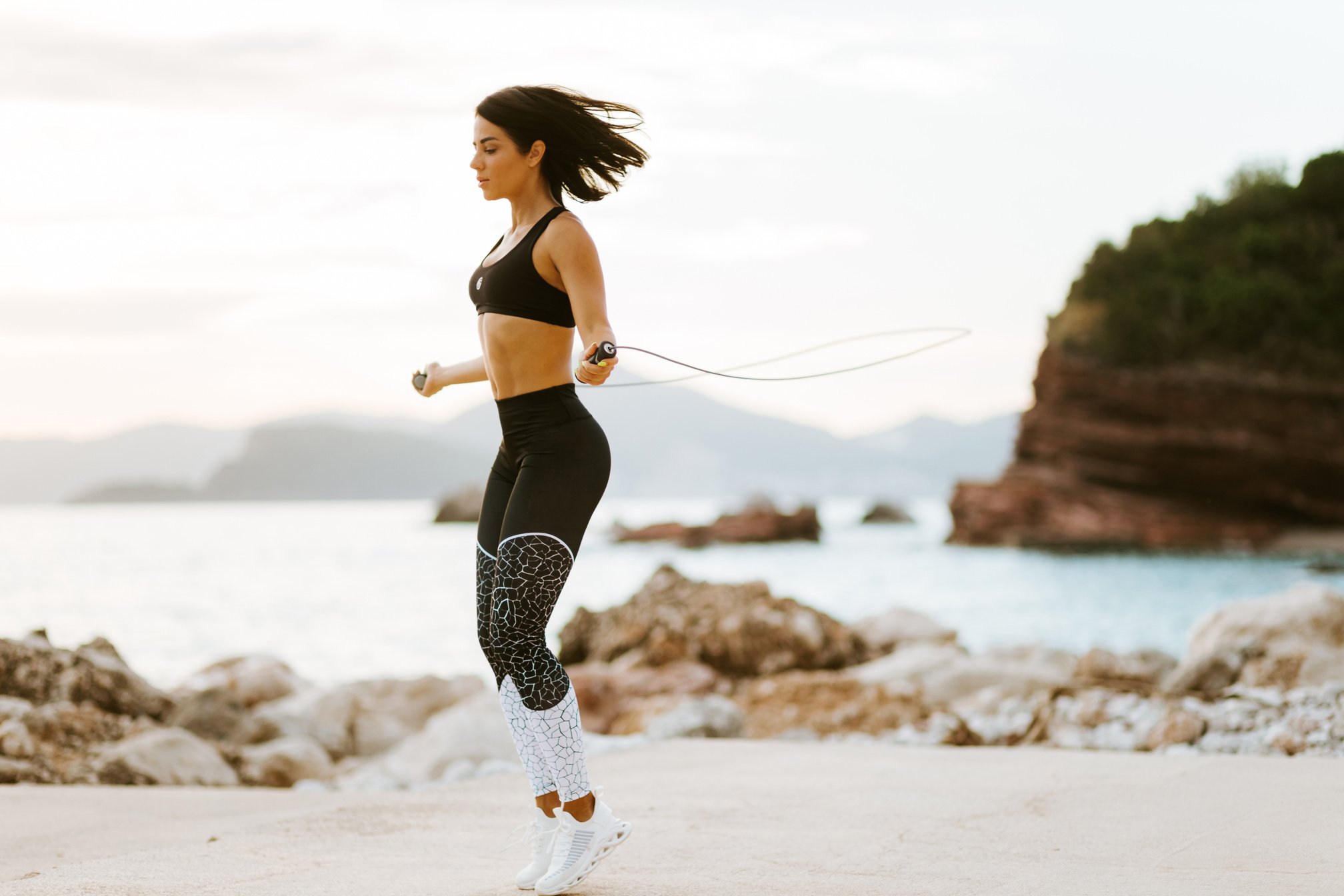 Woman Skipping Rope by the Beach